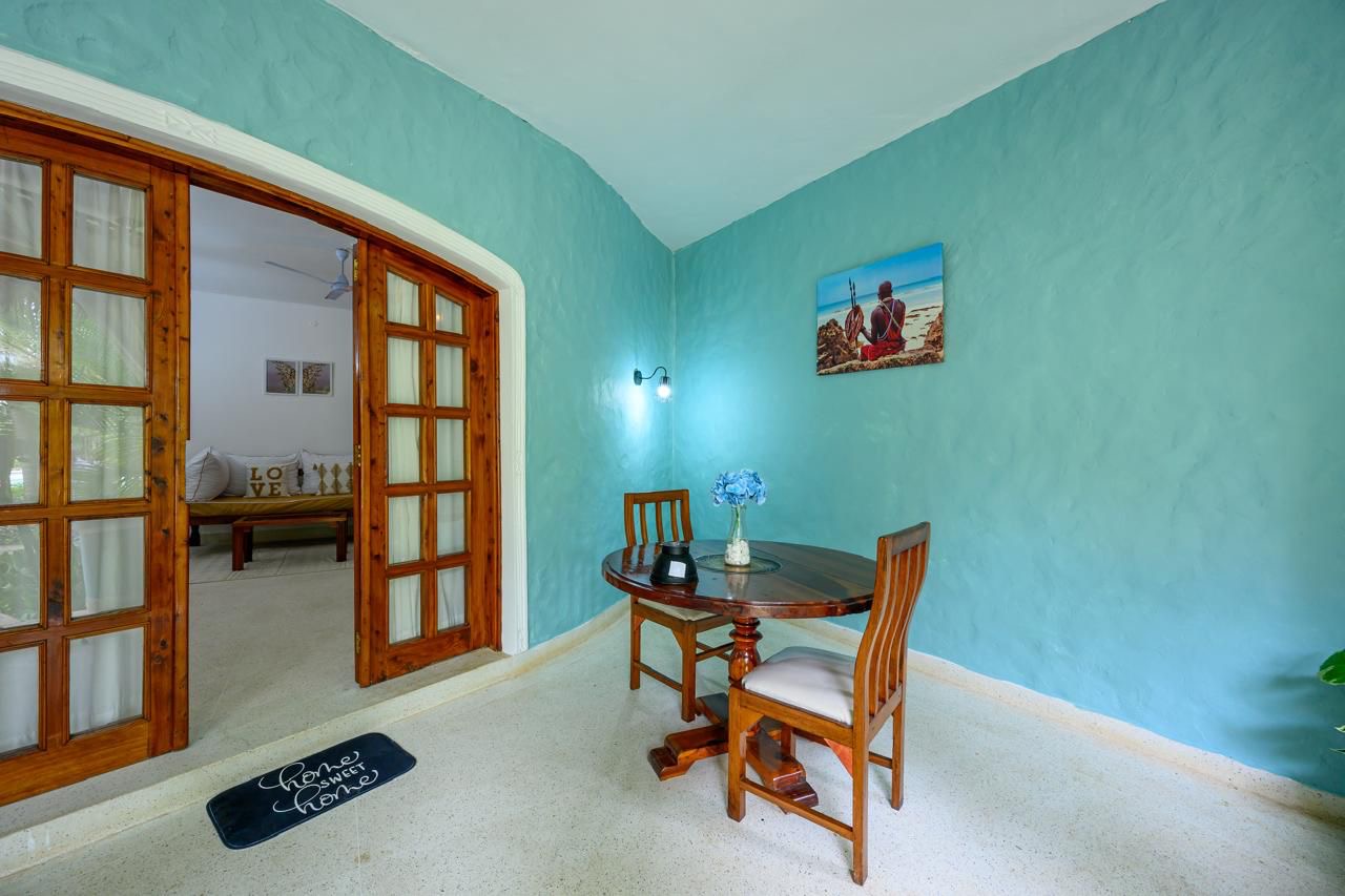 Welcoming entrance to the apartment with coastal decor and warm lighting