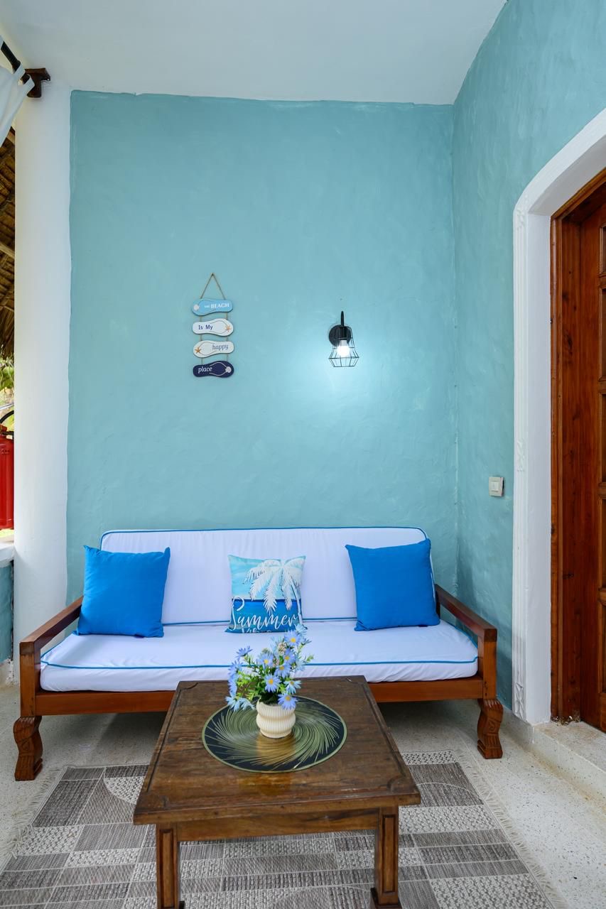 Private veranda with outdoor seating overlooking the garden