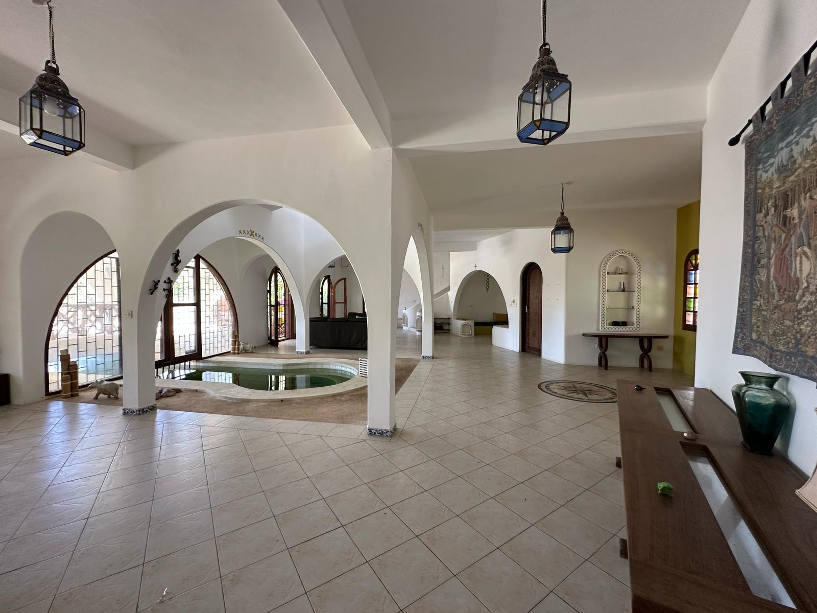 Arched indoor pool and living area