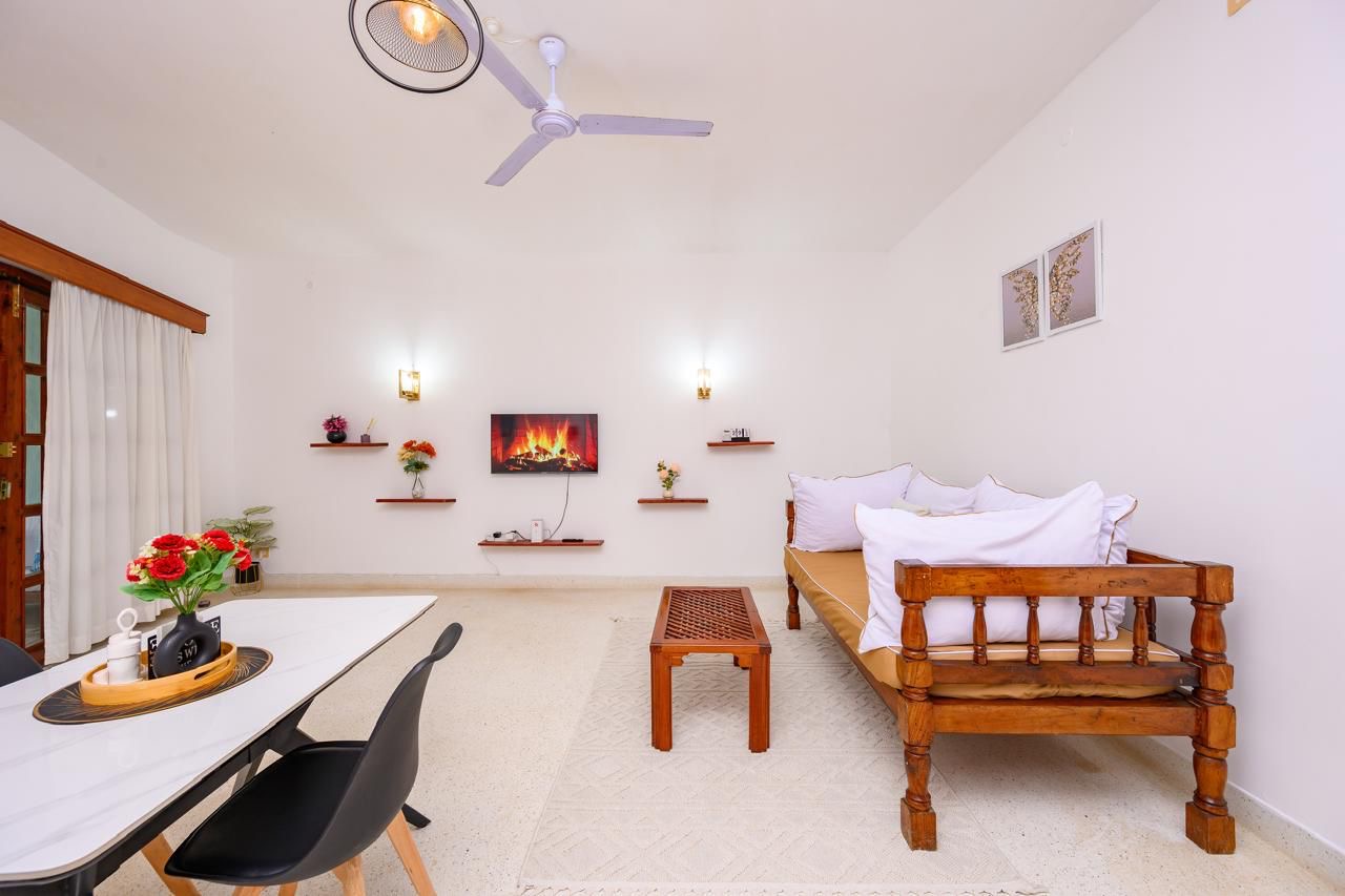 Elegant lounge area with plush sofa, soft cushions and natural light
